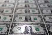 U.S. dollar banknotes are displayed in this illustration taken, February 14, 2022. U.S. dollar banknotes are displayed in this illustration taken, February 14, 2022.