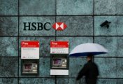 A file photo of a man walking past a HSBC bank branch in the City of London, Britain November 12, 2014. A file photo of a man walking past a HSBC bank branch in the City of London, Britain November 12, 2014.