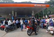A file photo shows people lining up for their turn to fill fuel at a petrol pump in Lucknow, India, November 9, 2016. A file photo shows people lining up for their turn to fill fuel at a petrol pump in Lucknow, India, November 9, 2016.