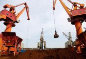 A file photo of cranes unloading imported iron ore from a cargo vessel at a port in Lianyungang, Jiangsu province, China October 27, 2019. A file photo of cranes unloading imported iron ore from a cargo vessel at a port in Lianyungang, Jiangsu province, China October 27, 2019.