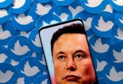 A file photo of an image of Elon Musk seen on a smartphone placed on printed Twitter logos in this picture illustration taken April 28, 2022. A file photo of an image of Elon Musk seen on a smartphone placed on printed Twitter logos in this picture illustration taken April 28, 2022.