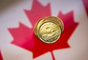 A Canadian dollar coin, commonly known as the A Canadian dollar coin, commonly known as the