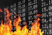 Investing during a recession Market ticker board in flames indicating market prices during a recession