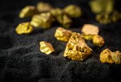Gold ore Nuggets of gold ore lying on a black background