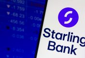 Starling Bank A smartphone displays the name and logo of Starling Bank