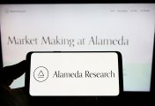 Alameda Research Alameda Research logo on smartphone and computer screen