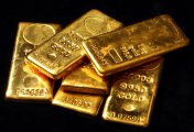 Gold bars A number of gold bars scattered on a black background