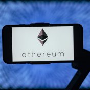 The logo of Ethereum (ETH) is seen displayed on a mobile phone screen