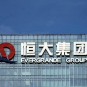 The company logo is seen on the headquarters of China Evergrande Group in Shenzhen, Guangdong province, China, September 26, 2021.