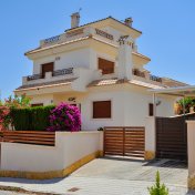 spain house price crash Canarian style houses in the resort town of Orihuela, La Zenia, Spain.
