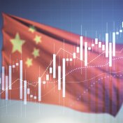 Multi exposure of virtual creative financial chart hologram on Chinese flag and blue sky background.