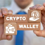 Hands holding blocks with crypto wallet on them