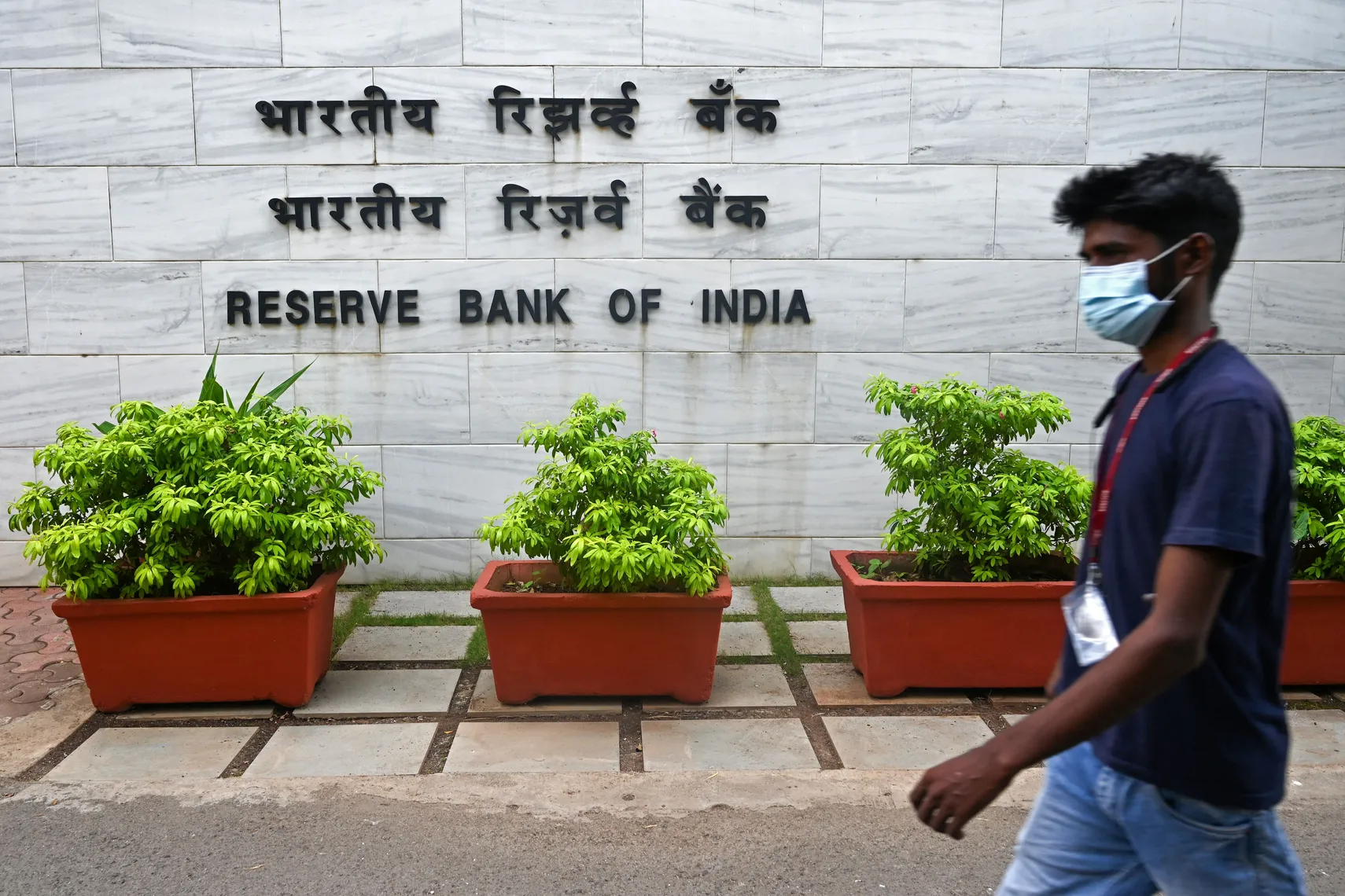 india interest rate forecast for next 5 years A pedestrian walks past the entrance of the Reserve Bank of India (RBI) headquarters in Mumbai