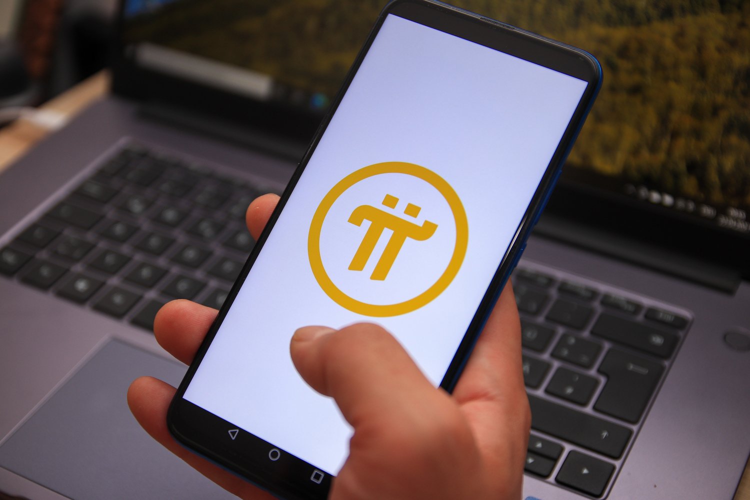 Pi Network logo displayed on a smartphone