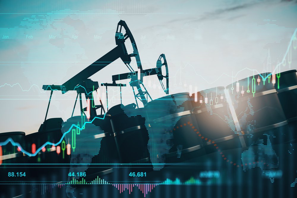 Oil pumping machinery in operation with barrels and digital screen with world map and financial chart graphs and indicators, natural resources stock market concept.