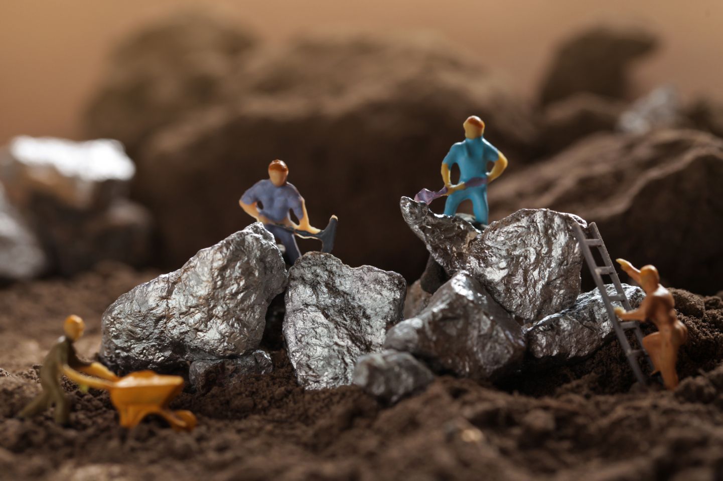 Lithium price forecast: Rising EV demand to cause new highs? Mining of Tantalum, Nickel, Cobalt, lithium. Miniature worker mining metal Tantalum and silver. Mining business, Mineral Resources.