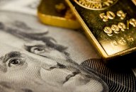 Gold price forecast Close-up of a $20 banknote and gold bullion
