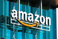 Amazon A large Amazon logo displayed on the side of an Amazon building