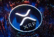 XRP price prediction: Will XRP rise to $1? XRP logo depicted in white pinpoint lights on a blue and multicoloured background of pinpoint lights