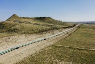 A file photo of an extension of Denbury Inc's Greencore carbon pipeline is ready to be lowered into its trench, in Montana, U.S., 2021. A file photo of an extension of Denbury Inc's Greencore carbon pipeline is ready to be lowered into its trench, in Montana, U.S., 2021.