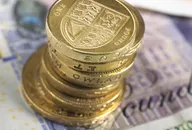 British banknotes and coins photographed directly above