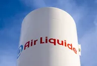 Air Liquide logo displayed on an industrial storage tank against a blue sky