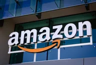 Amazon logo on the exterior of a modern glass office building