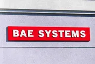 BAE Systems logo mounted on the exterior of a company building, representing the global aerospace, defence, and security technology company.