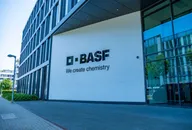 BASF headquarters building featuring the company logo and the slogan "We create chemistry" on the exterior wall