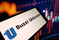 Logo Buzzi Unicem su dispositivo mobile con grafici finanziari, che rappresenta l'azienda di cemento e materiali da costruzione nel contesto del mercato azionario
