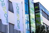 BioNTech flags displayed outside a modern building