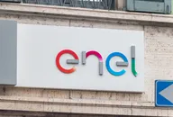 Enel logo mounted on the exterior wall of a company building.