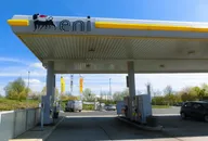 Eni gas station canopy with fuel pumps