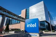 Intel office building at Gordon Moore Park with a large Intel logo sign in the foreground under a clear blue sky