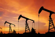 Oil pump oil rig energy industrial machine for petroleum in the sunset background