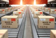 Cardboard boxes with Chinese-made text and a Chinese flag on a roller conveyor.