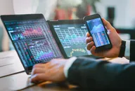 Business man working with trader graphics concept.