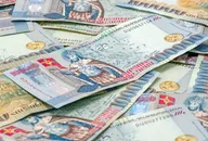 Close-up of Armenian Dram in AMD 100,000 banknotes. Business and finance concept. Macro composition with selective focus and blurred background