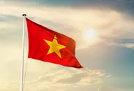 Vietnam national flag cloth fabric waving on the sky with beautiful sun light - Image