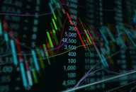 Representative candlestick chart with a double exposure of a graph to illustrate finance
