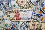 US dollar and Egyptian pound banknotes overlapped