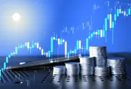 Piles of coins against a backdrop of a rising graph, depicting inflation
