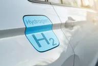 Hydrogen fuel car with H₂ badge on the vehicle body.