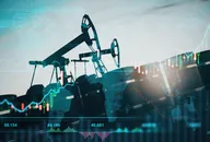 Oil pumping machinery in operation with barrels and digital screen with world map and financial chart graphs and indicators, natural resources stock market concept.