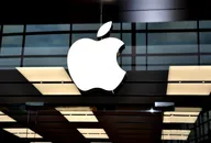 Apple company logo on a modern retail store exterior.