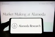 Alameda Research logo on smartphone and computer screen 