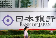 A woman passing through in front of The Bank of Japan, Nippon Ginkō