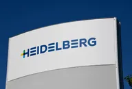 Heidelberg logo on a sign against a blue sky.