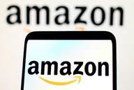 Amazon logo displayed on a smartphone screen with a blurred Amazon logo in the background