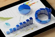 Display of stock market quotes with urban scene reflect on glass